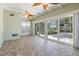 Sunroom with herringbone tile floor and large windows at 7754 Westmoreland Dr, Sarasota, FL 34243
