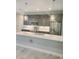 Modern kitchen with stainless steel appliances, quartz counters, kitchen island and pendant lighting at 13126 Marathon Blvd, Port Charlotte, FL 33981