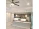 Modern kitchen featuring stainless steel appliances, a kitchen island with pendant lighting and ample storage at 13126 Marathon Blvd, Port Charlotte, FL 33981