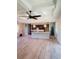 Open living space with wood floors, trey ceiling, decorative lighting and kitchen island at 13126 Marathon Blvd, Port Charlotte, FL 33981