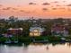 Aerial view of upscale waterfront homes with docks at 757 Hideaway Bay Dr, Longboat Key, FL 34228