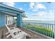 This balcony provides stunning views of the water and direct access to the main bedroom at 757 Hideaway Bay Dr, Longboat Key, FL 34228