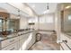 Bathroom features soaking tub, vanity with granite countertop, and glass shower at 757 Hideaway Bay Dr, Longboat Key, FL 34228
