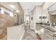 Bathroom with walk-in shower, granite countertops, and access to the bedroom at 757 Hideaway Bay Dr, Longboat Key, FL 34228