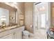Elegant bathroom with marble vanity, and seamless access to the walk-in shower at 757 Hideaway Bay Dr, Longboat Key, FL 34228