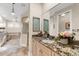 Bathroom features granite countertops, custom cabinets, soaking tub, and glass enclosed shower at 757 Hideaway Bay Dr, Longboat Key, FL 34228