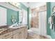 Well-appointed bathroom with granite counters, updated fixtures, and a tiled shower/tub combo at 757 Hideaway Bay Dr, Longboat Key, FL 34228