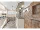 Bathroom with walk in shower, soaking tub, and double vanity with granite countertops at 757 Hideaway Bay Dr, Longboat Key, FL 34228