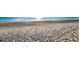 Texture and detail of rippled oceanfront beach sand in full sun at 757 Hideaway Bay Dr, Longboat Key, FL 34228