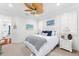 Relaxing bedroom with ceiling fan, coastal decor, and comfortable furnishings create a serene atmosphere at 757 Hideaway Bay Dr, Longboat Key, FL 34228