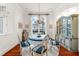 Charming dining room with elegant chandelier, round table setting, and natural light for memorable meals and gatherings at 757 Hideaway Bay Dr, Longboat Key, FL 34228