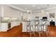 Gourmet kitchen boasts granite countertops, custom cabinetry, and an eat-in bar for elegant entertaining and culinary creativity at 757 Hideaway Bay Dr, Longboat Key, FL 34228