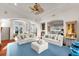 Spacious living room showcasing a fireplace, comfortable seating, and open floor plan perfect for gatherings and relaxation at 757 Hideaway Bay Dr, Longboat Key, FL 34228