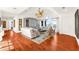 Large living room with hardwood floors, high ceilings, a ceiling fan, and water view at 757 Hideaway Bay Dr, Longboat Key, FL 34228