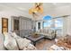 Bright living room with hardwood floors, grey cabinets, water view, and stylish furniture at 757 Hideaway Bay Dr, Longboat Key, FL 34228