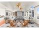 Inviting living room featuring hardwood floors, a ceiling fan, and plenty of natural light at 757 Hideaway Bay Dr, Longboat Key, FL 34228