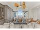 Bright living room boasting hardwood floors, grey cabinets, water views, and stylish furniture at 757 Hideaway Bay Dr, Longboat Key, FL 34228
