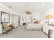 Spacious main bedroom has ceiling fan, sitting area, and ensuite bathroom at 757 Hideaway Bay Dr, Longboat Key, FL 34228