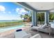 Inviting outdoor patio featuring a pool, hot tub, lounge chairs, and stunning bay views at 757 Hideaway Bay Dr, Longboat Key, FL 34228
