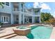 Inviting backyard with a sparkling pool and spa, perfect for outdoor relaxation and entertaining at 757 Hideaway Bay Dr, Longboat Key, FL 34228