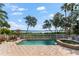 Inviting pool and spa overlook the bay, creating a serene outdoor space at 757 Hideaway Bay Dr, Longboat Key, FL 34228