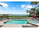 Refreshing swimming pool and spa with a beautiful view of the bay at 757 Hideaway Bay Dr, Longboat Key, FL 34228