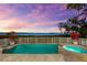 Backyard pool and hot tub, surrounded by lush landscaping and waterfront scenery at 757 Hideaway Bay Dr, Longboat Key, FL 34228