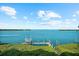 Scenic water view from home overlooking tranquil bay with private dock and lush green surroundings at 757 Hideaway Bay Dr, Longboat Key, FL 34228