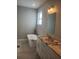 Bathroom with double vanity, free-standing tub, and modern fixtures at 13126 Marathon Blvd, Port Charlotte, FL 33981