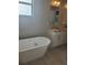 Elegant bathroom with soaking tub, double vanity, and granite countertops at 13126 Marathon Blvd, Port Charlotte, FL 33981