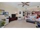 Living room with comfortable seating and view into kitchen area at 6360 Watercrest Way # 301, Bradenton, FL 34202