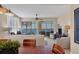 Spacious living room with access to a screened balcony and lake view at 6360 Watercrest Way # 301, Bradenton, FL 34202