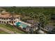Community pool and clubhouse near a golf course and lush landscape at 6360 Watercrest Way # 301, Bradenton, FL 34202