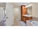 Bathroom with a soaking tub, vanity, and access to a toilet area at 6360 Watercrest Way # 301, Bradenton, FL 34202
