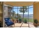 Peaceful screened balcony with lake view and comfortable seating at 6360 Watercrest Way # 301, Bradenton, FL 34202