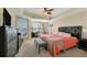 King-size bedroom with balcony access and water views at 6360 Watercrest Way # 301, Bradenton, FL 34202