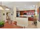 Modern kitchen with granite countertops and dark wood cabinets at 6360 Watercrest Way # 301, Bradenton, FL 34202