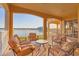 Relaxing balcony overlooking lake with patio furniture at 6360 Watercrest Way # 301, Bradenton, FL 34202