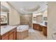 Spa-like bathroom featuring a large soaking tub and double vanity at 6360 Watercrest Way # 301, Bradenton, FL 34202