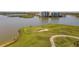 Aerial view showcasing the property's waterfront location and golf course at 6360 Watercrest Way # 301, Bradenton, FL 34202