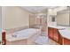 Elegant bathroom with soaking tub, double vanity, and separate shower at 6360 Watercrest Way # 301, Bradenton, FL 34202