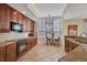 Kitchen with breakfast nook, granite counters, and ample cabinetry at 6360 Watercrest Way # 301, Bradenton, FL 34202