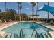 Inviting pool with steps and handrails, surrounded by lounge chairs at 6360 Watercrest Way # 301, Bradenton, FL 34202