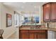 Kitchen with granite countertop, stainless steel sink, and water views at 6360 Watercrest Way # 301, Bradenton, FL 34202