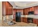 Modern kitchen with granite countertops and stainless steel appliances at 6360 Watercrest Way # 301, Bradenton, FL 34202