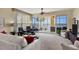 Comfortable living room with lake view and access to screened balcony at 6360 Watercrest Way # 301, Bradenton, FL 34202