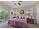 Bright bedroom with a queen bed and access to balcony at 6360 Watercrest Way # 301, Bradenton, FL 34202