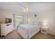 Bedroom with queen-size bed and plenty of natural light at 8499 Topeka Cir, Port Charlotte, FL 33981