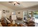 Relaxing living room with sliding doors leading to the pool area at 8499 Topeka Cir, Port Charlotte, FL 33981