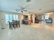 Open concept dining area with a view of living room and kitchen at 9390 Gulfstream Blvd, Englewood, FL 34224